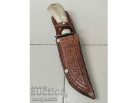 Hunting knife with a deer antler handle