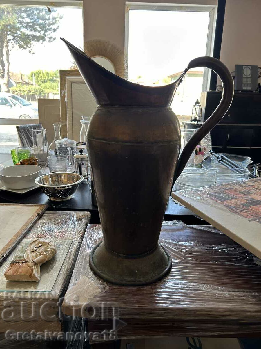 Tall antique copper vessel