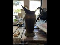 Tall antique copper vessel