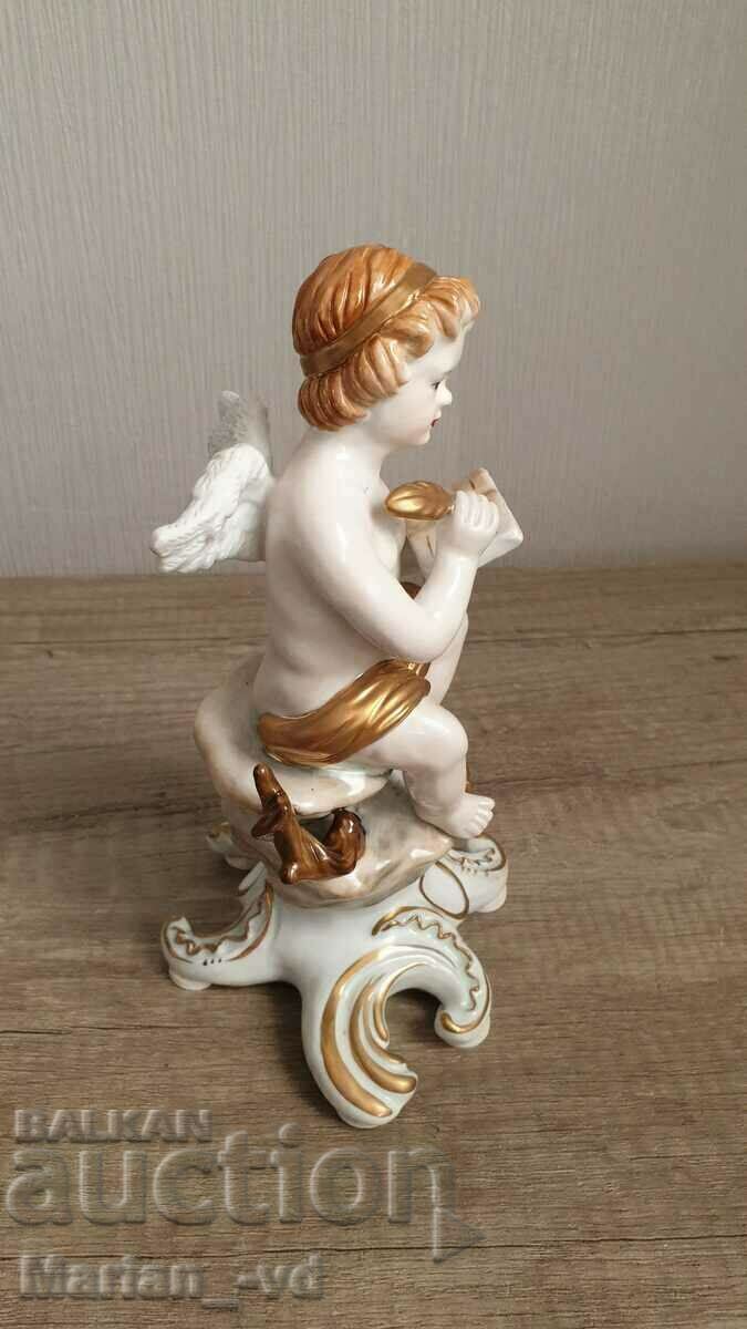 Old porcelain angel figure with price 300.00 BGN | € 153.39 Old porcelain angel figure with price 300.00 BGN | € 153.39