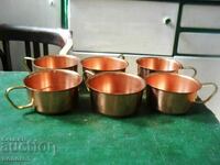 Set of copper mugs for coffee or tea