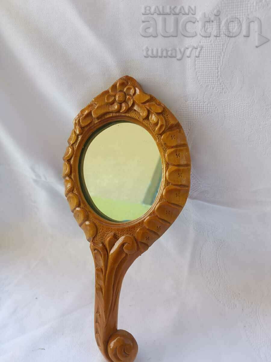 Old wooden social mirror