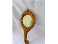 Old wooden social mirror