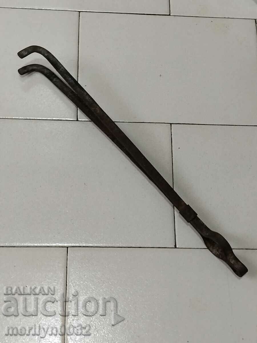 Old dilaf, tongs, wrought iron for foot