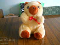 Plush children's toy with a mechanism - a bear