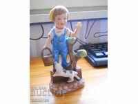 Boy with a puppy - biscuit porcelain