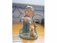 Boy with two small dogs - biscuit porcelain