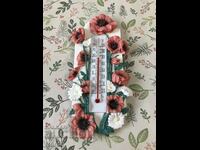 A thermometer with a beautiful decoration