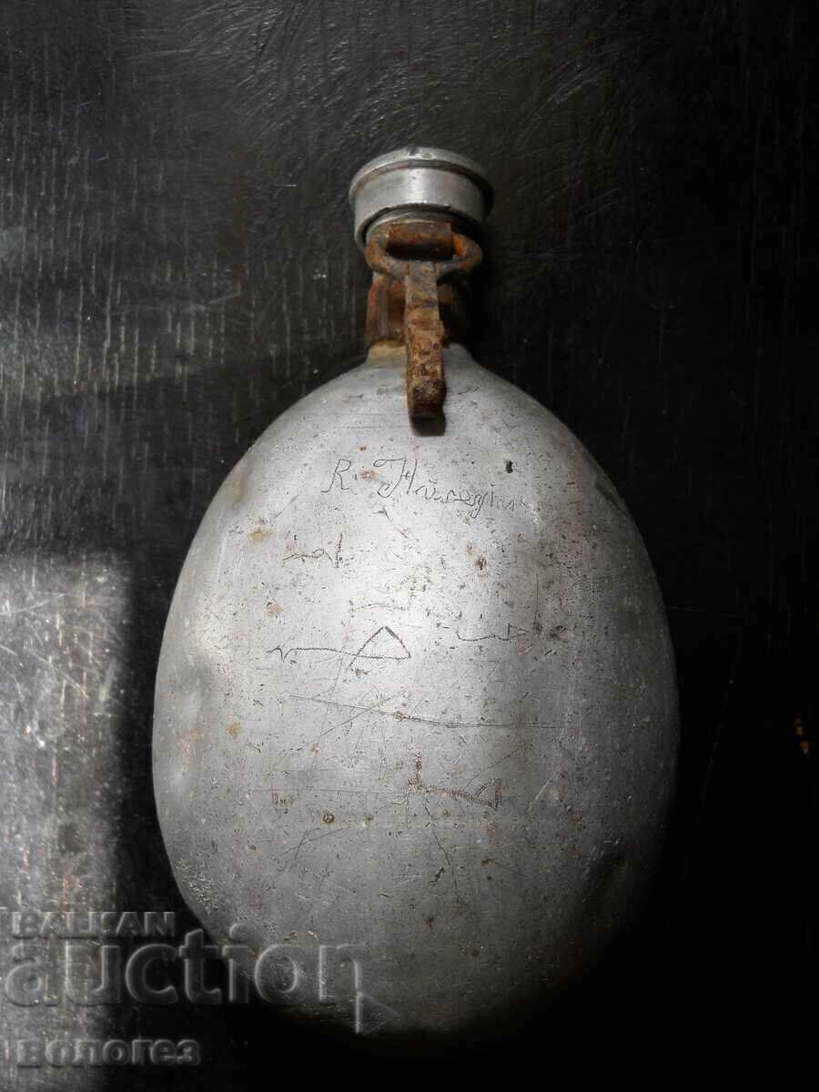 Old military canteen with inscription