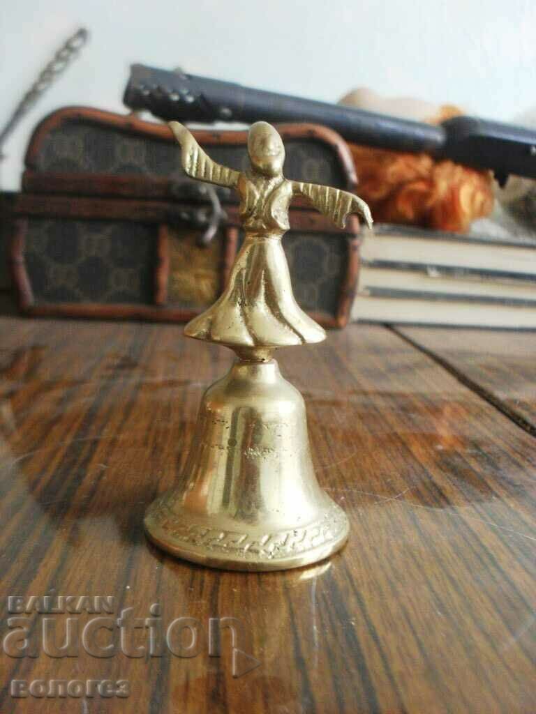 Antique bronze bell with a dancing dervish