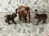 Three wooden elephants