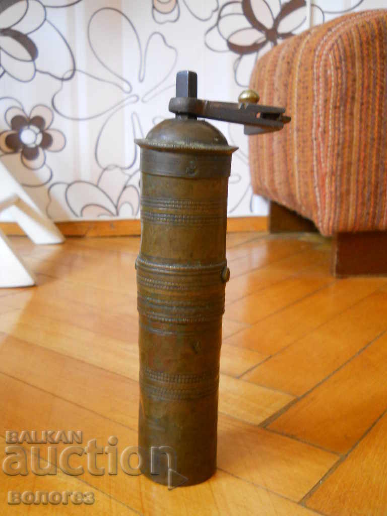 Old bronze coffee grinder with markings