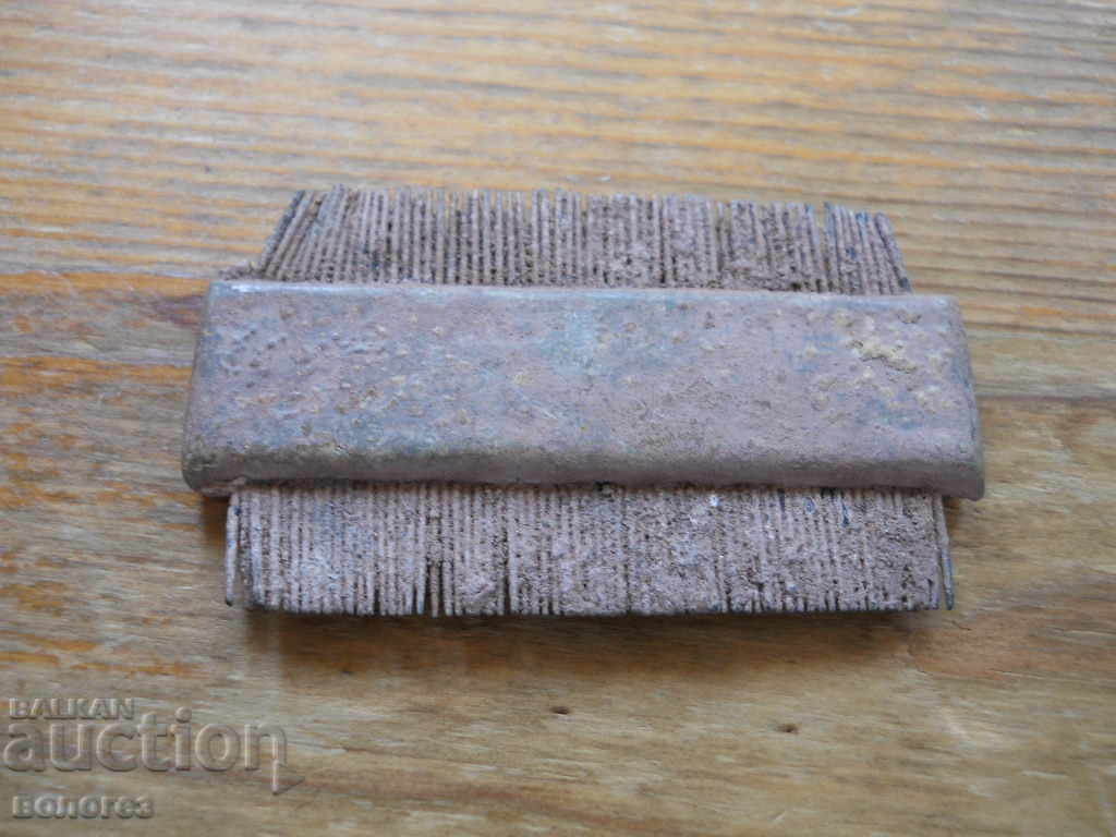 Old bronze comb (comb) for horses