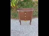 A small wooden chest of drawers!