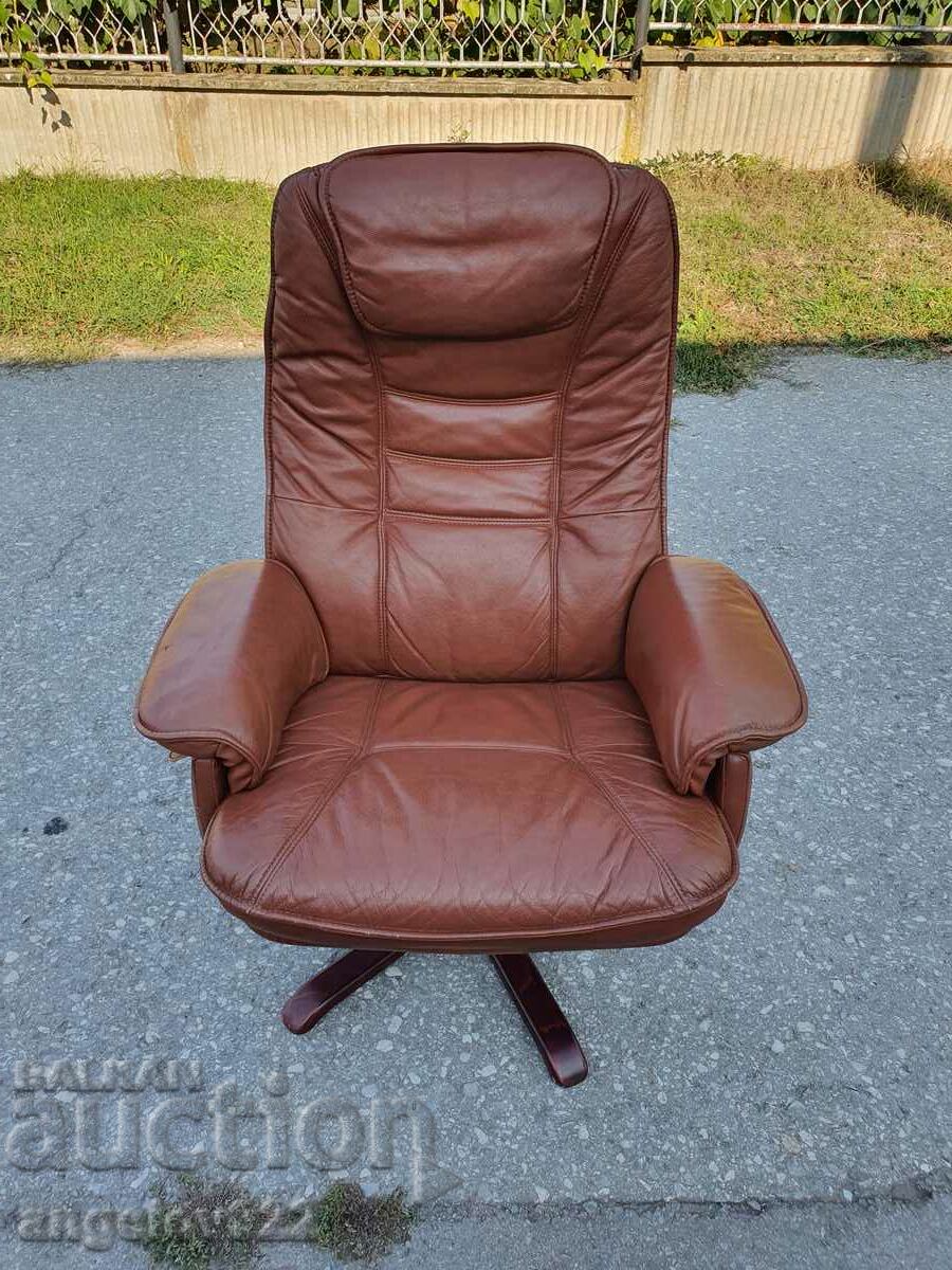 Beautiful solid leather swivel chair with sleep option!