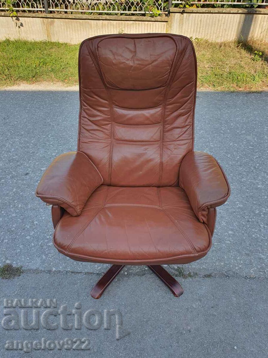 Beautiful solid leather swivel chair with sleep option!