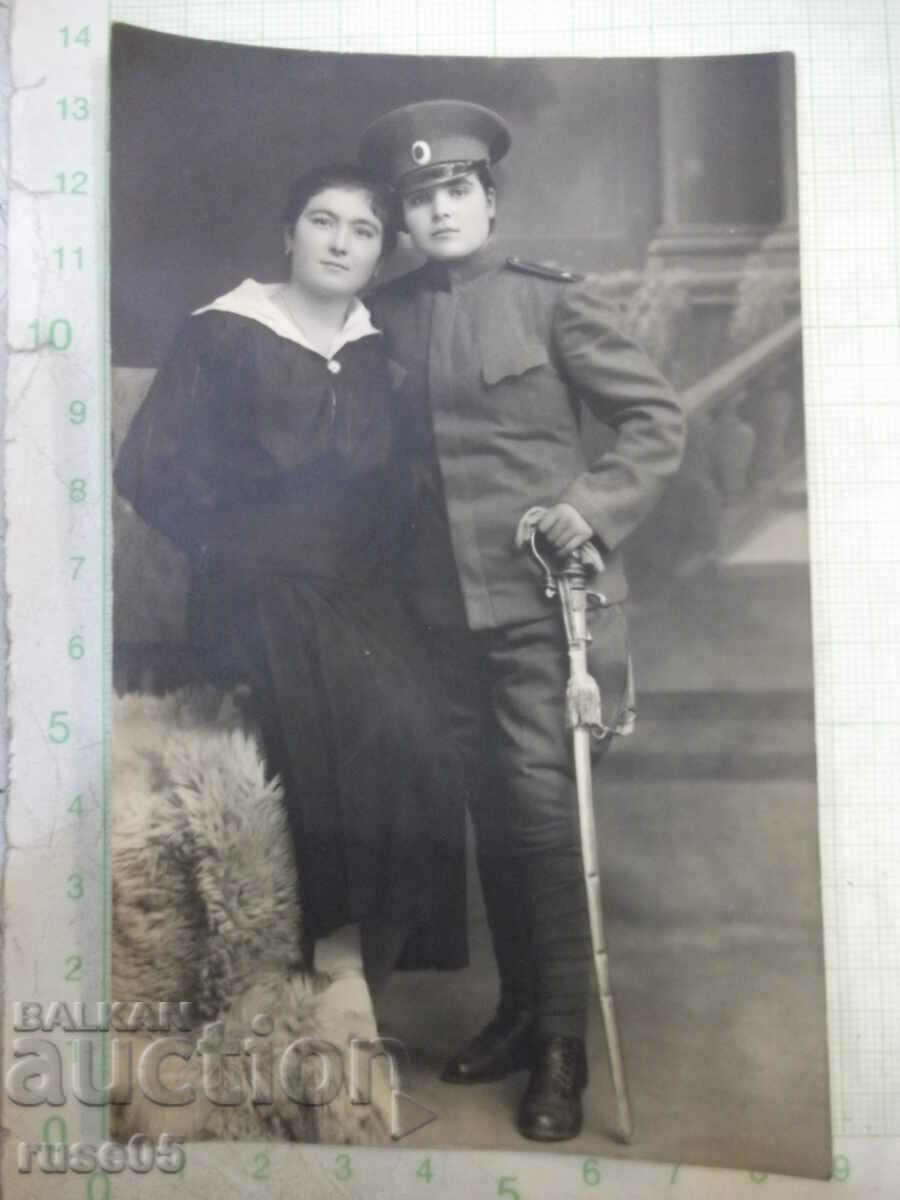 Old photo of civilian and uniform