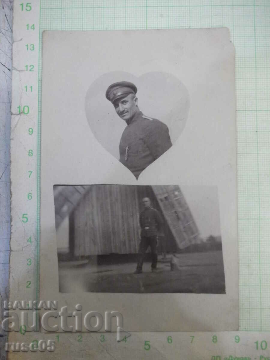 Old photo of a man in uniform in front of a windmill