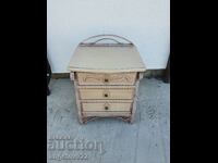 A beautiful wooden chest of drawers with a metal frame!