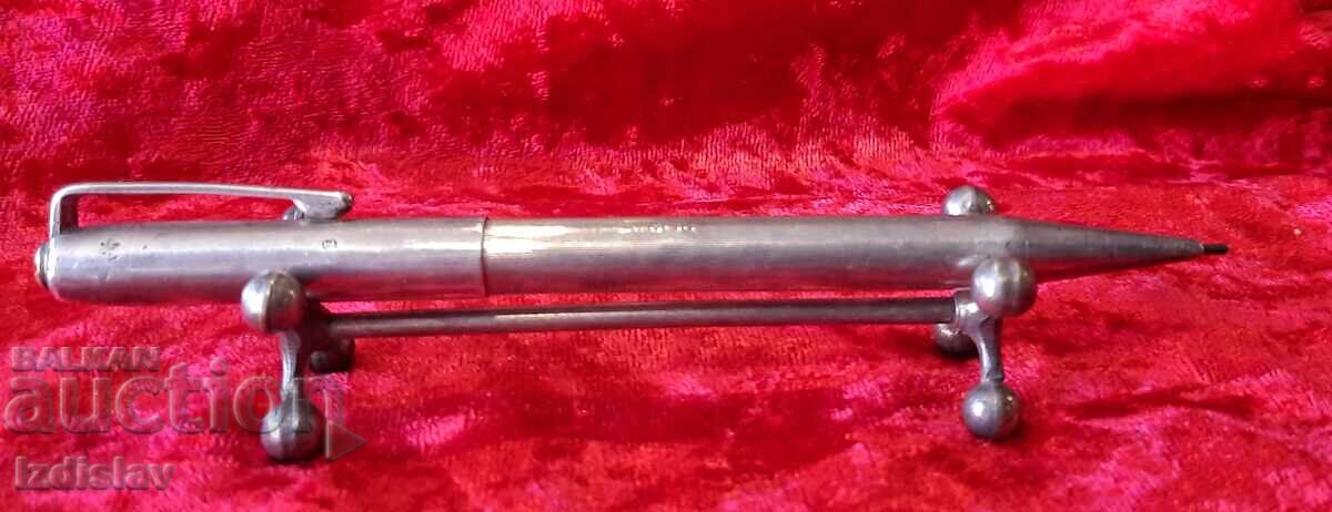Vintage silver mechanical pencil with markings. Vintage silver mechanical pencil with markings.