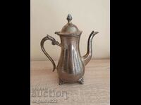 A beautiful old metal kettle