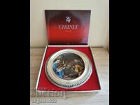 A collectible porcelain plate with a silver plated metal frame!