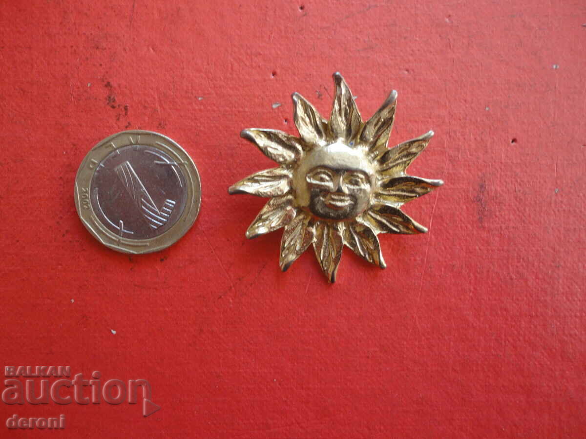 Gold-plated sun 84 brooch