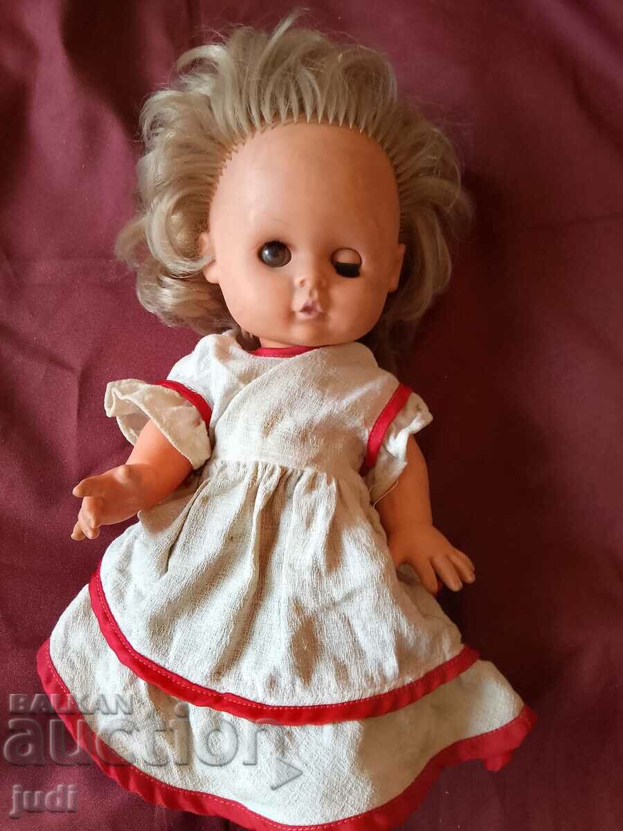 Social doll with blinking eyes