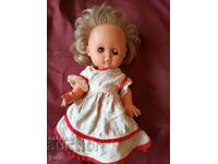 Social doll with blinking eyes