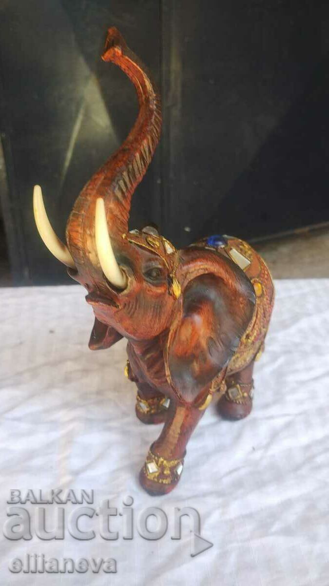 Auction  Wooden elephant with stones 20 cm