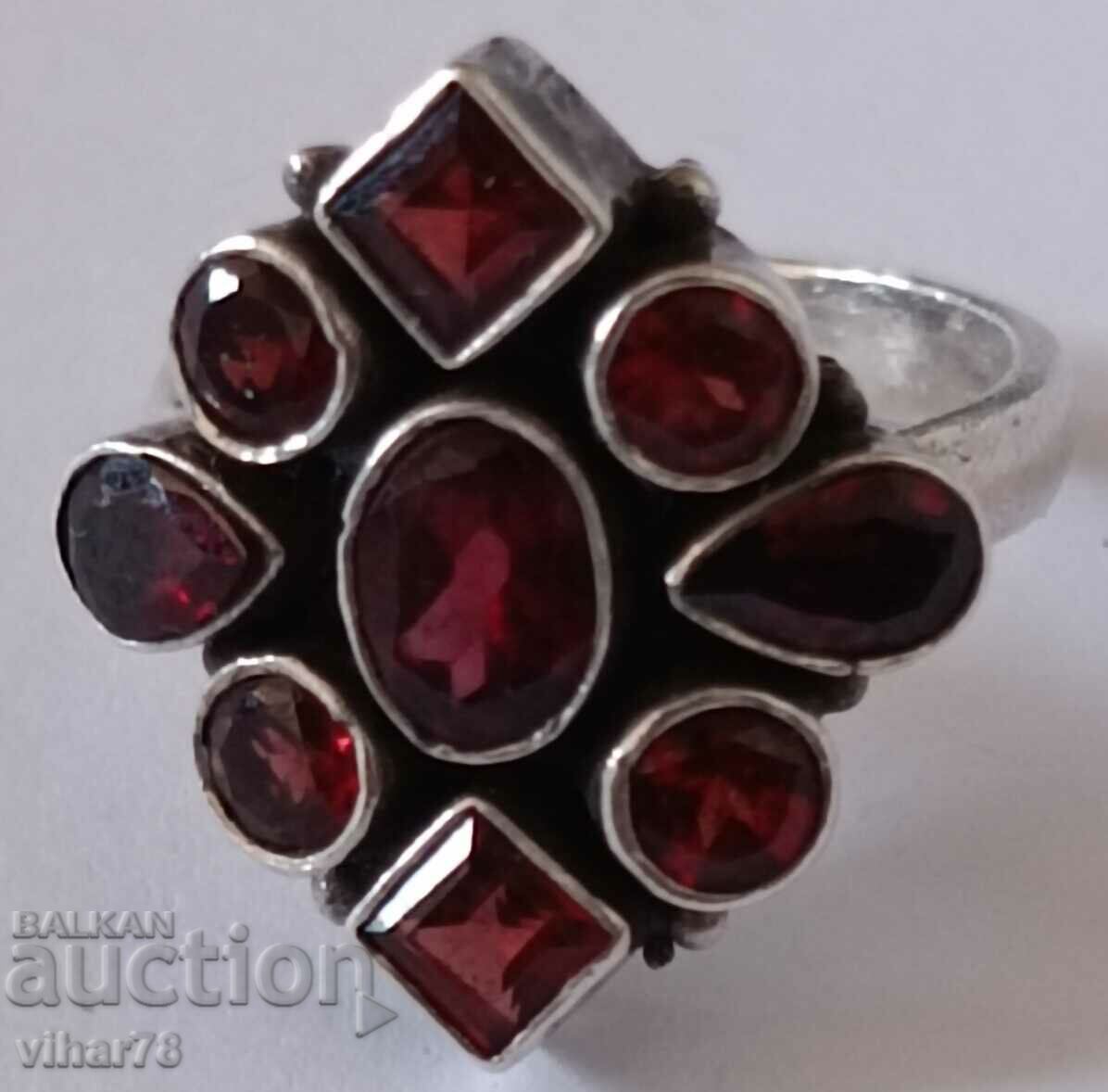 Women's silver ring with garnets with price 164.99 BGN | € 84.36 Women's silver ring with garnets with price 164.99 BGN | € 84.36