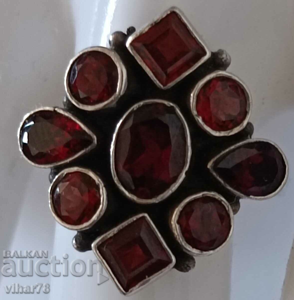 Delivery of Women's silver ring with garnets Delivery of Women's silver ring with garnets
