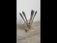 Old silver plated fruit knives with stand