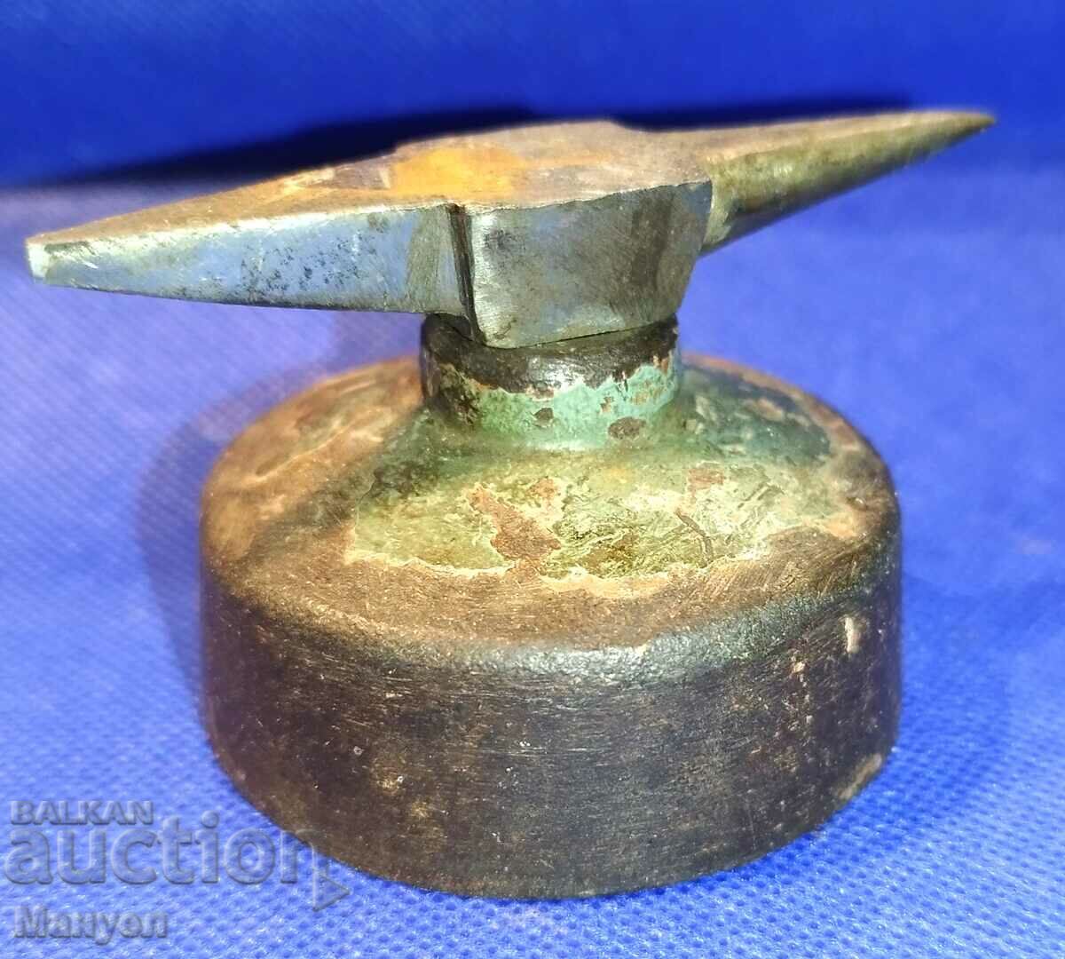 An old, small craftsman's anvil.