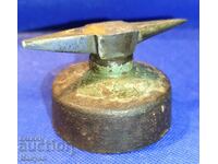 An old, small craftsman's anvil.