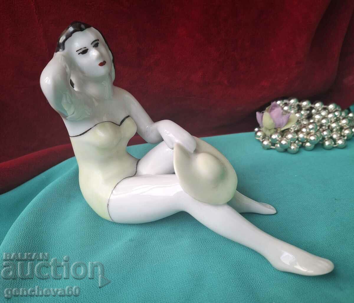 Old porcelain figurine of "Woman with a hat"