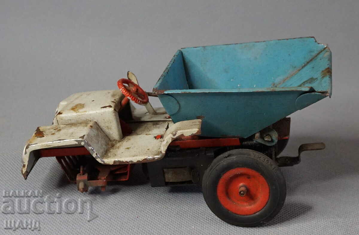 Old German metal mechanical toy model dump truck