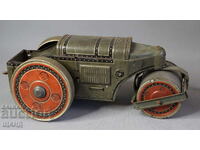 Old metal mechanical toy roller model