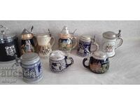 Collection of embossed German ceramic beer steins - 10 PIECES!