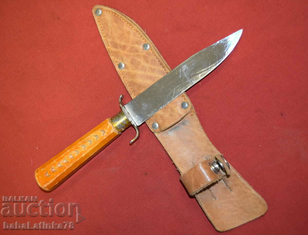 Old hunting knife with wooden handle