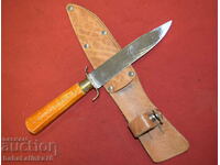 Old hunting knife with wooden handle