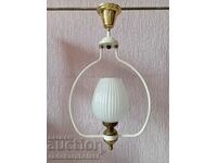 A beautiful white chandelier with a white glass shade