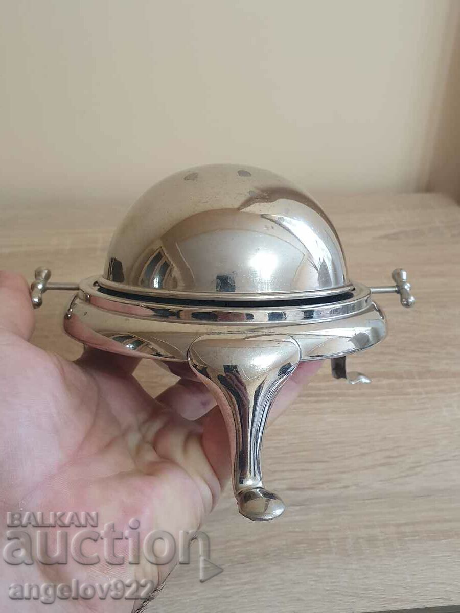 An interesting metal container with a closing lid