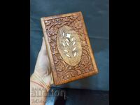 A beautiful wooden jewelry box with rich carving and mother of pearl