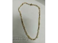 Pearl necklace with Keshi pearls silver and gold!