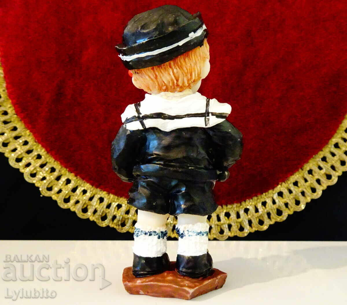 Auction  Porcelain statuette, figure of a sailor child.