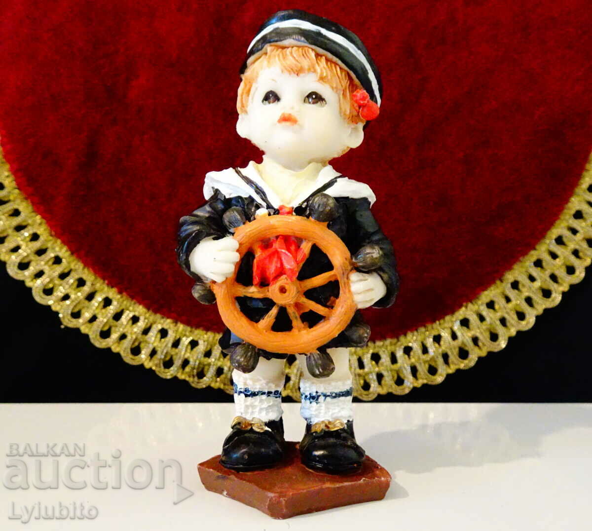 Porcelain statuette, figure of a sailor child.