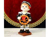 Porcelain statuette, figure of a sailor child.