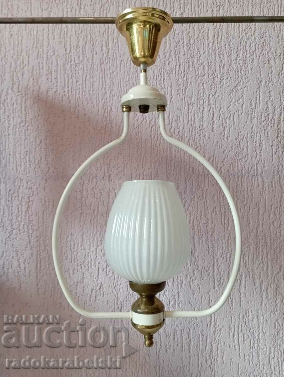 A beautiful white chandelier with a white glass shade