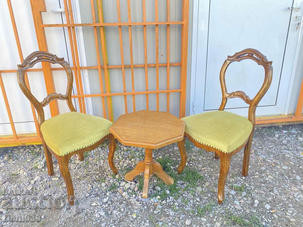 A beautiful set of 2 baroque chairs and a massive coffee table